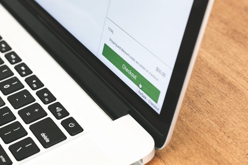 Close-up photograph of a laptop, showing the 'checkout' function of an e-commerce website.