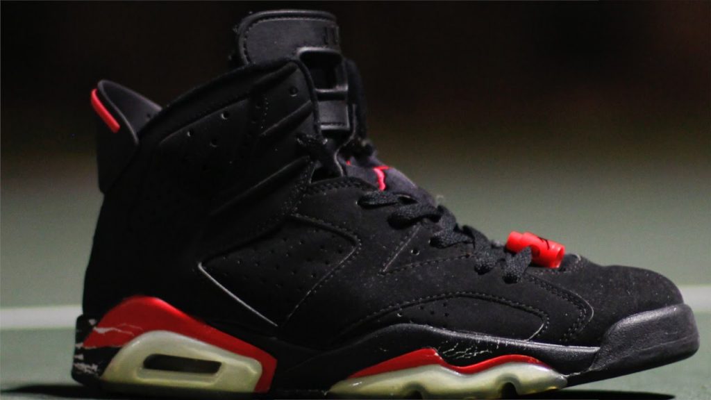 Photograph of a shoe: a black, red and white Nike Air Jordan 6 trainer by brand Nike