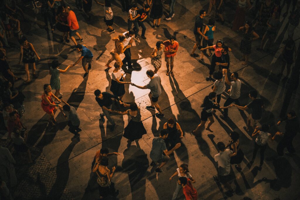 big group of people dancing in pairs