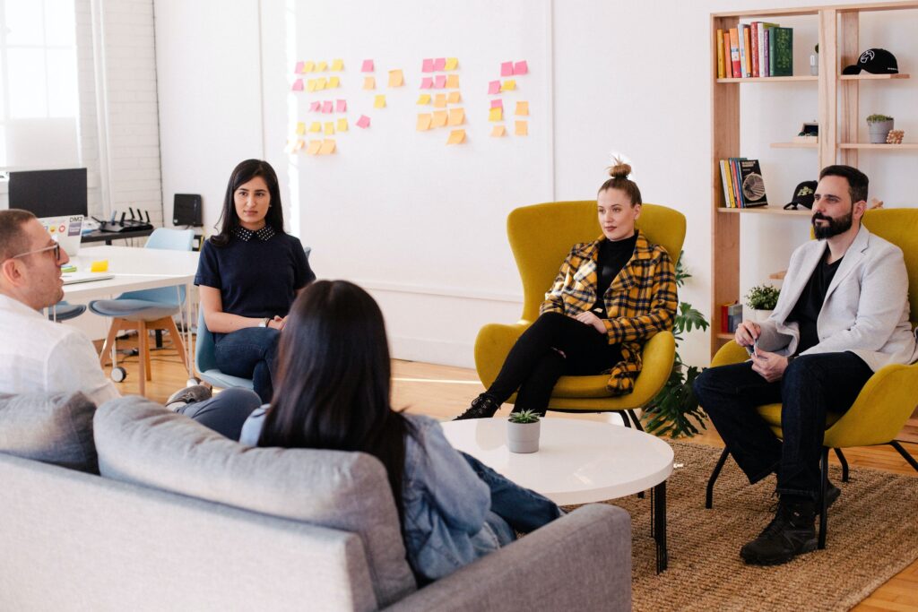 Group of young professionals sitting around a table having a meeting